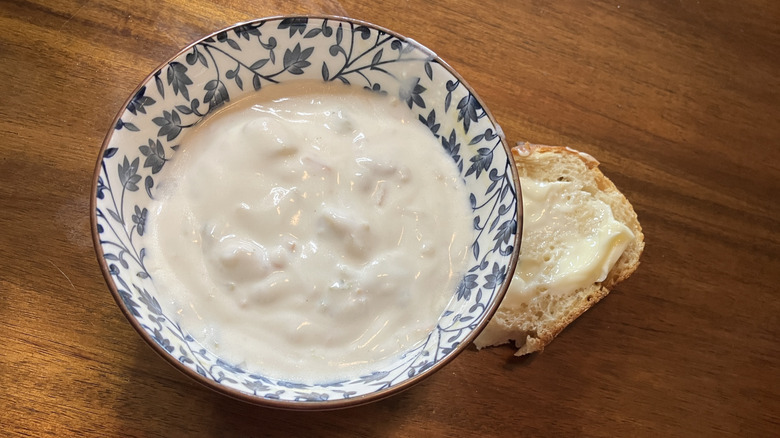 bowl of chowder and a piece of bread