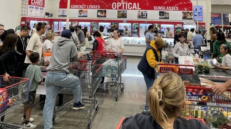 A busy line of shoppers inside a Costco
