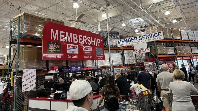 Shoppers waiting on line at the membership counter at Costco