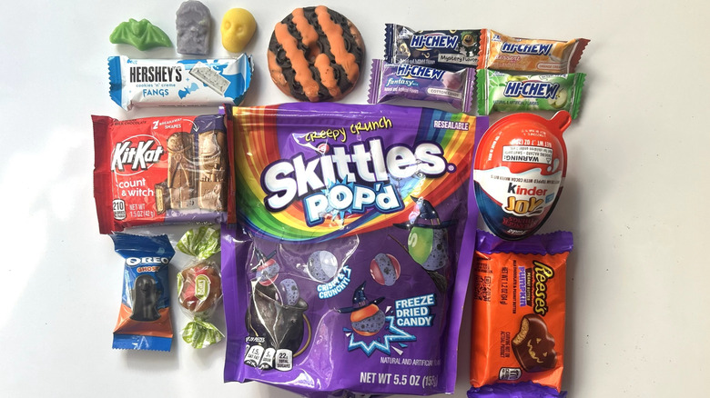 Collection of Halloween candy in and out of the wrappers