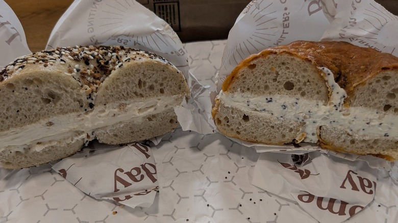 Everything bagel with fig cream cheese, and Old bay cheddar bagel with everything cream cheese at Twin Bears Bakery
