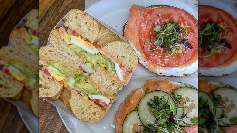 Assorted bagel sandwiches, including lox and guacamole and egg at Black Sheep Bagel cafe