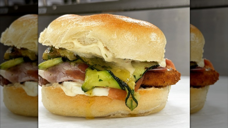 Plain bagel with ham, cheese, and veggies at Benji's Bagel and Coffee House