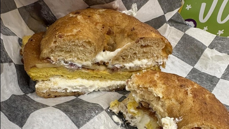bagel sandwich with cream cheese on wax paper from Belington Bakery