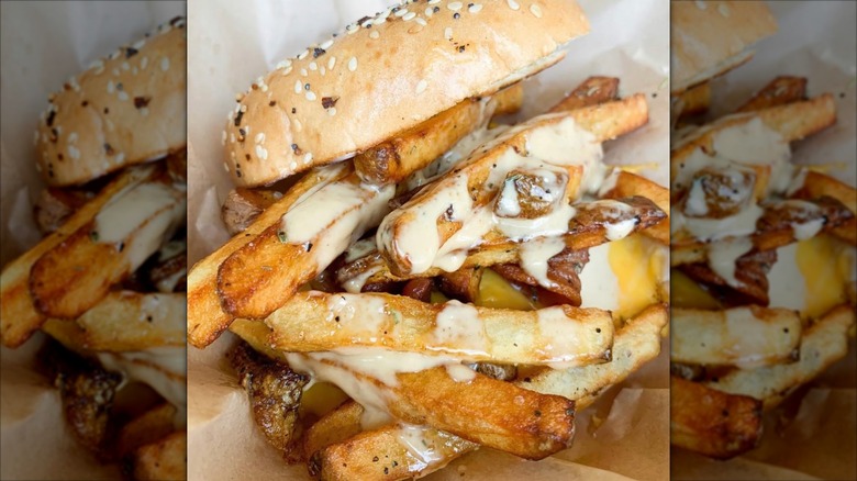 Street Thyme food truck: Fried egg, bacon, American cheese, hand cut fries, truck sauce on a toasted everything bagel