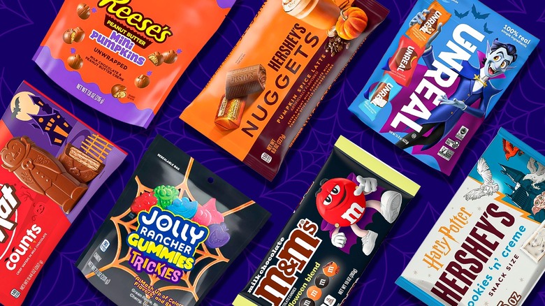 various new 2025 Halloween candy packages on a blue background