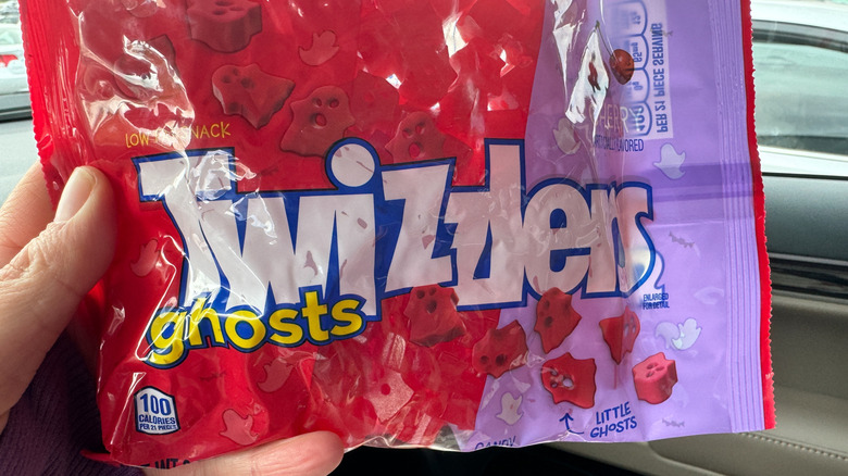 hand holding bag of Twizzlers Ghosts
