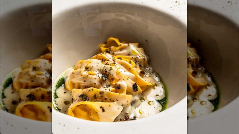 tagliatelle pasta with sauce, braised veal, dried caper, spinach pesto from Frasca Food and Wine restaurant in Colorado.