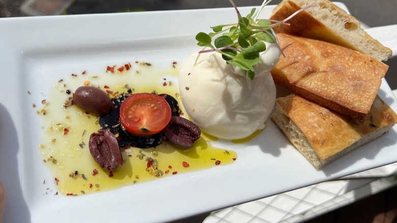 Burrata with fresh focaccia bread from Cipriano's Kitchen Kawaihae 