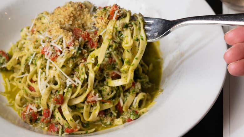 Fork lifts some pasta from a fettucini pasta dish from Broders' Pasta Bar in Minneapolis