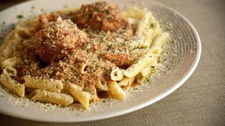 Penne pasta with red sauce, meatballs, and parmesan cheese from Mangia Italiana restaurant in Omaha.