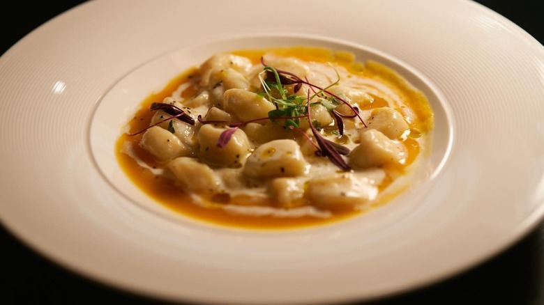 Buttternut squash gnocchi plated in dish from Matteo Ristorante Italiano in Utah.