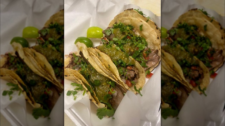 3 meat tacos from Salsas Oaxaqueña on paper wrapper