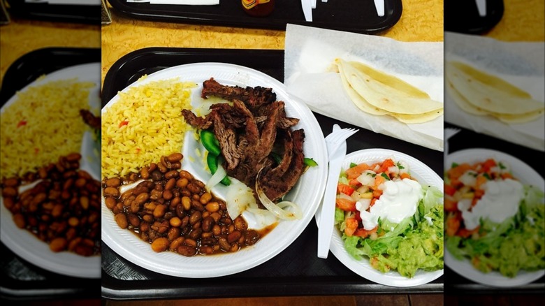 Jazmin Cuisine assorted Mexican dishes on styrofoam plates on a tray
