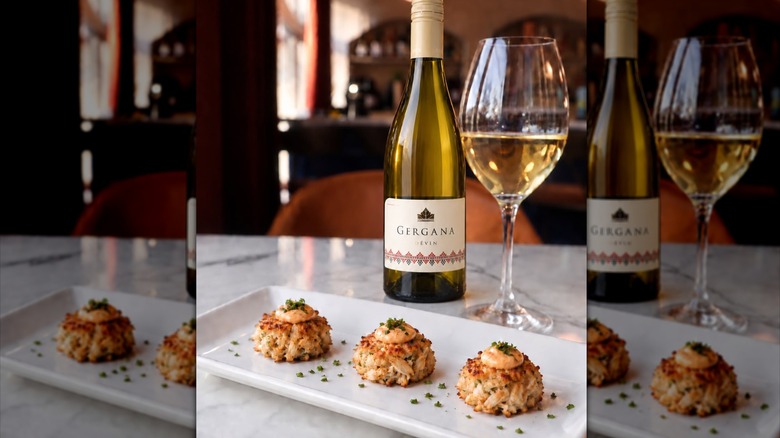 Crab cakes and a bottle and glass of white wine from Era Wine Bar