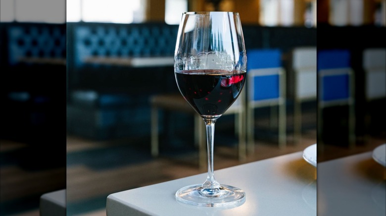 Glass of red wine on a table at Bravo!