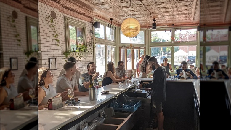 Customers sitting at the bar at 'ssippi during the day time