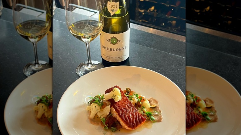 Seared salmon with cauliflower and a bottle and glass of Bourgogne white wine at Cree Wine Company