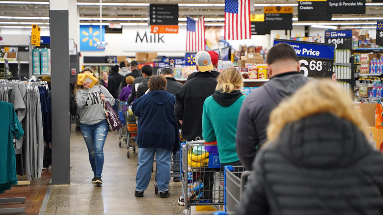 People waiting in a long line at Walmart