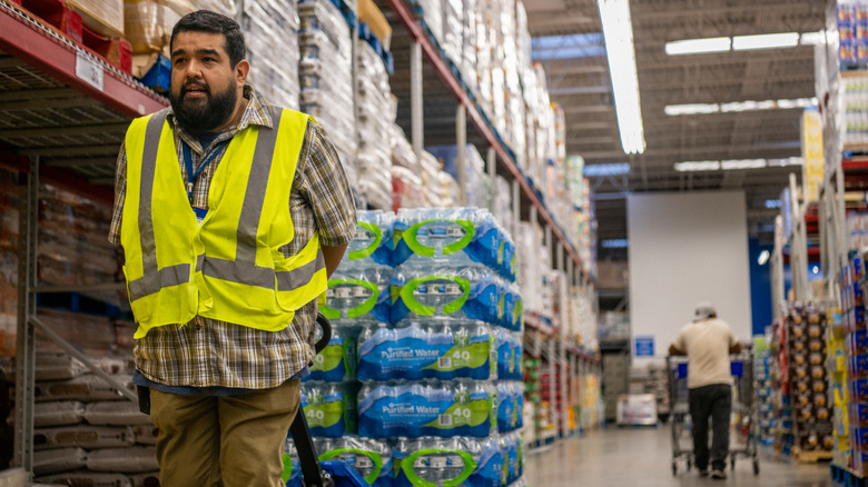 Walmart worker restocking