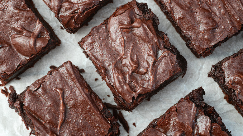 Three rows of homemade brownies in close-up