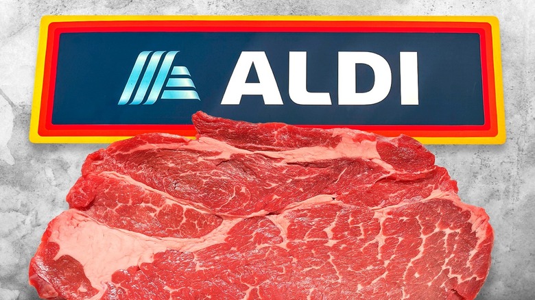 A raw steak in front of the Aldi logo on a marbled background