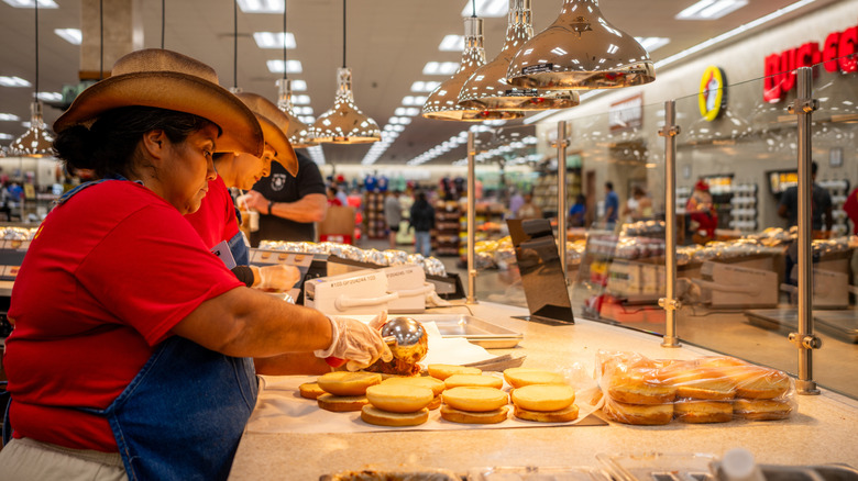 Buc-ee's employees prepare sandwiches to serve