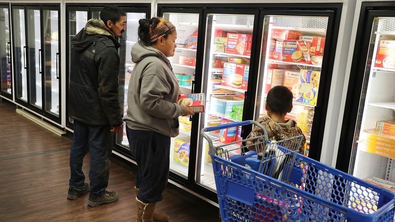 a family shops in an Alaskan grocery store