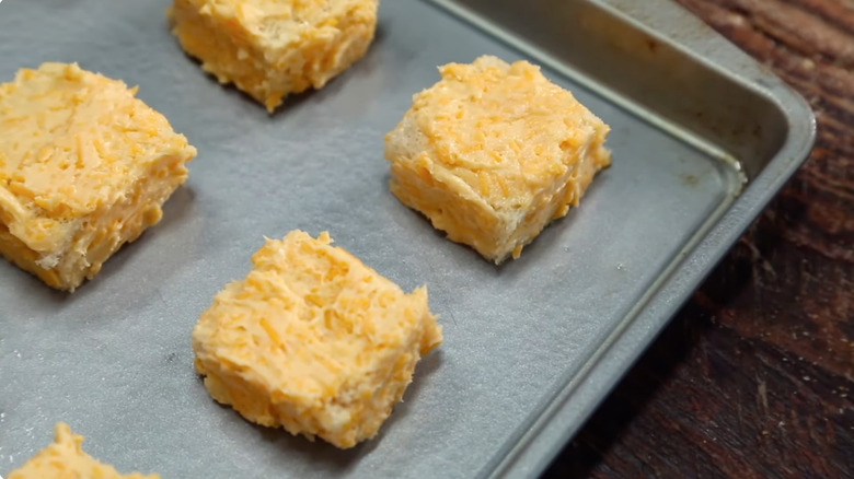 Uncooked cheese dreams on baking sheet