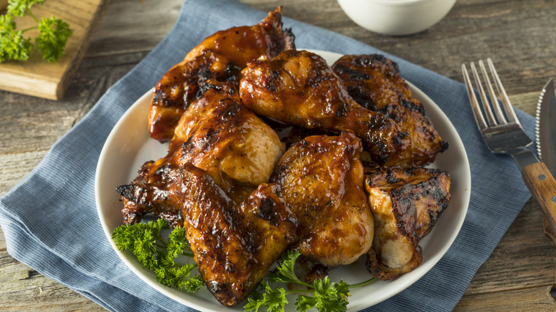 Plate of barbecued chicken pieces