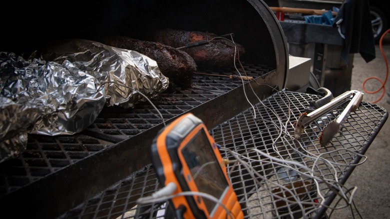 foil-wrapped brisket on smoker