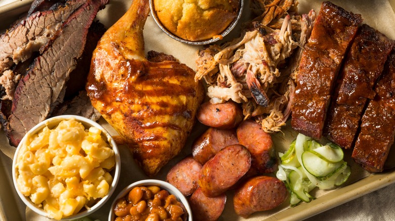 Barbecue platter with ribs, chicken, brisket, and pulled pork