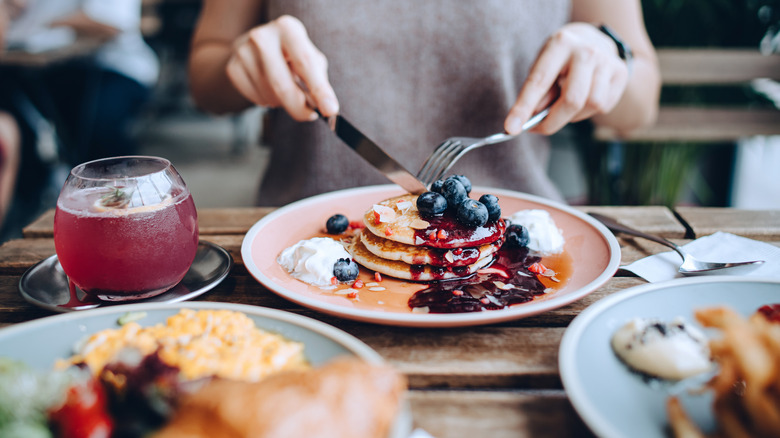 person eating brunch in restaurant