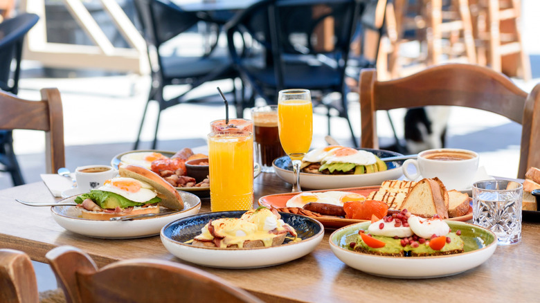 brunch foods and drinks on outdoor table