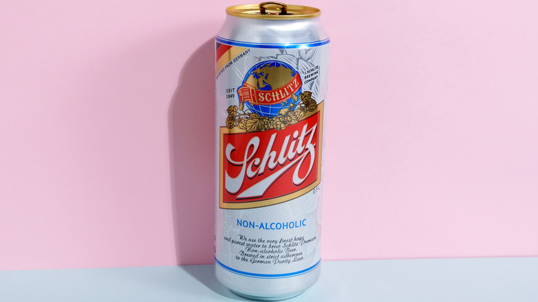 A can of Schlitz beer on a pink background
