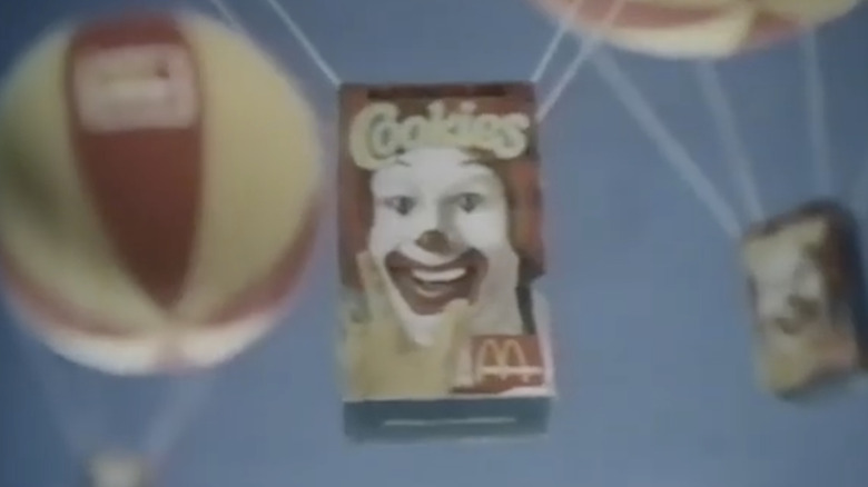 Screenshot of McDonaldland cookie commercial featuring Ronald McDonald on box.
