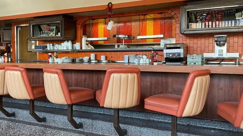 Astro Family Restaurant interior counter seating with open grill