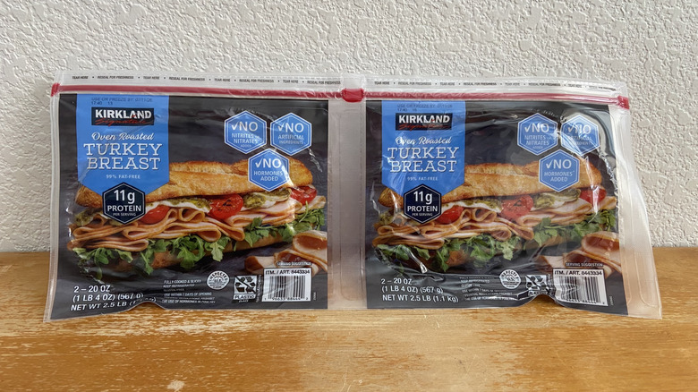 Two Kirkland Signature roasted turkey breast packages on table