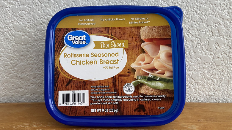 Package of Great Value chicken breast propped up on wooden table