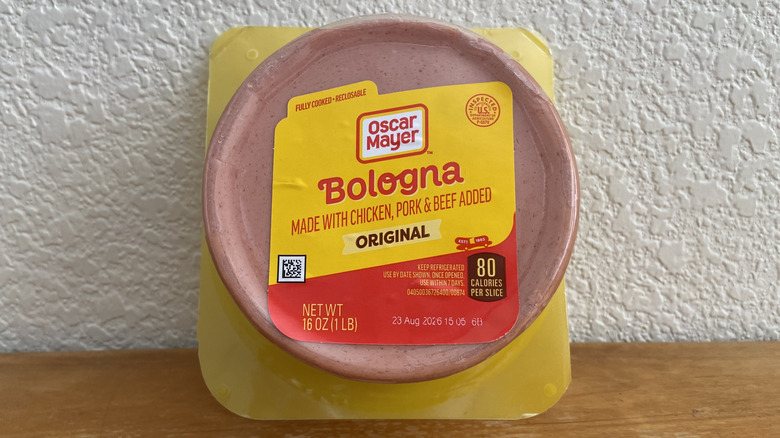 Package of Oscar Mayer bologna propped up on a wooden table