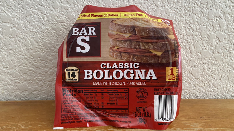 Package of Bar-S bologna propped up on a wooden table