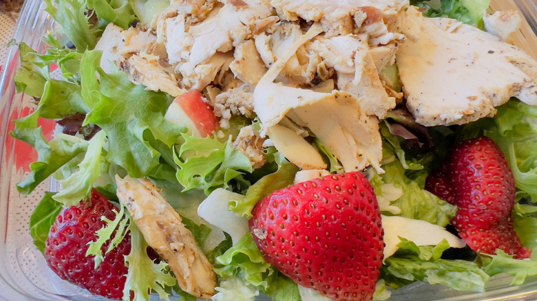 A Chick-fil-A market salad with strawberries and chicken