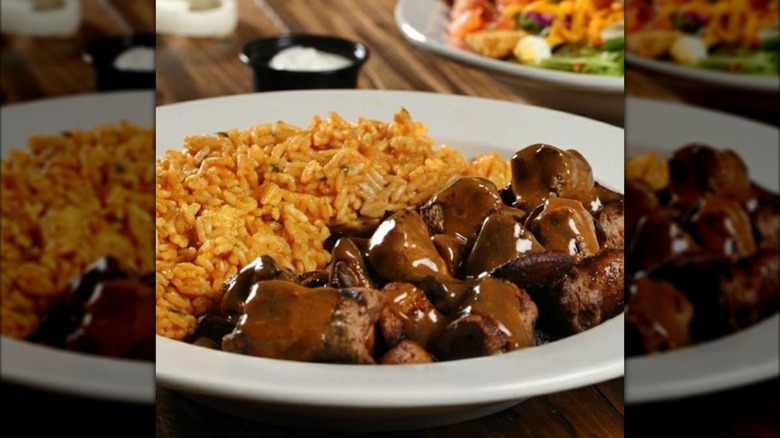 Texas Roadhouse Beef Tips with seasoned rice
