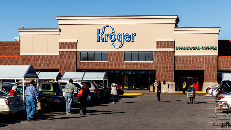 Exterior of a Kroger grocery store with shoppers heading inside