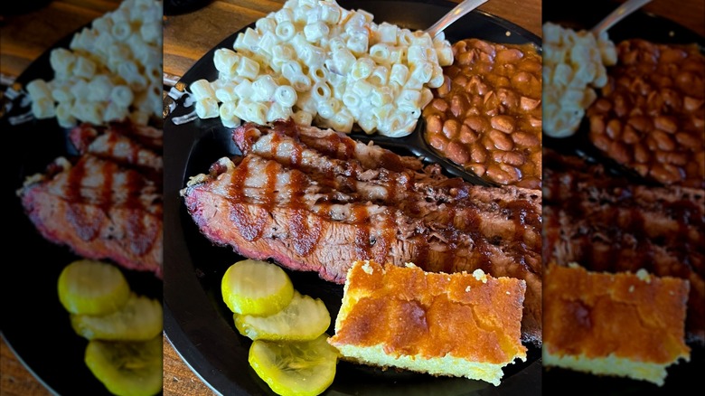 Beef Brisket Plate with sides of Mac and Cheese, Baked Beans, cornbread, and pickles from Brother's Barbecue