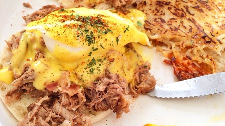 Sweet E's Café Kalua shredded Pork Eggs Benedict with side of hashbrowns