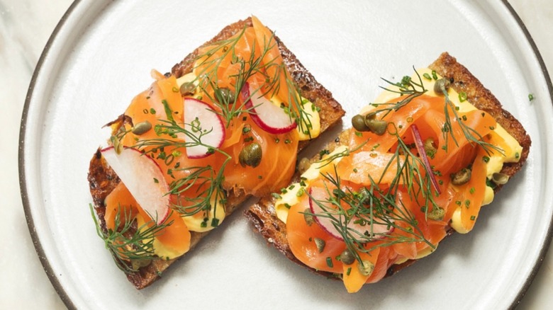 Lula Cafe salmon toast topped with radishes, capers, and fresh dill at brunch