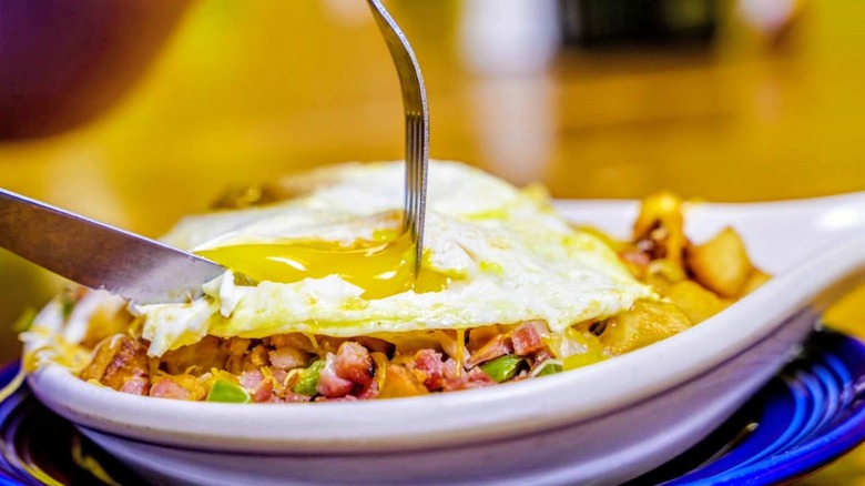 Bradley's Corner Cafe brunch with fried egg over diced ham, veggies, and potatoes