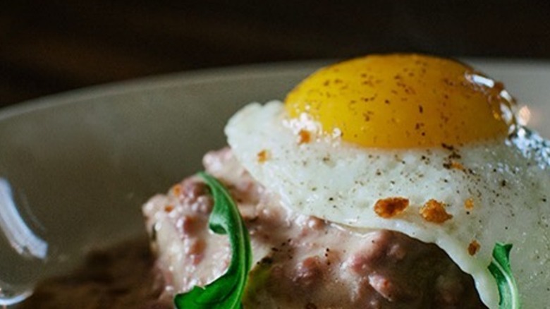 Gralehaus brunch biscuits and gravy with sunny side up egg