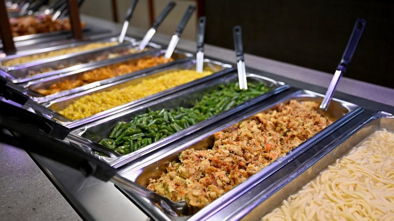 Buffet items featuring corn, green beans, pasta dishes at Der Dutchman